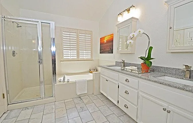 Master bath with separate shower and soaking tub