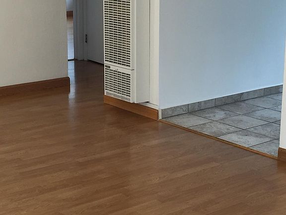 tile floor in kitchen. wood floor in Livingroom and bedrooms