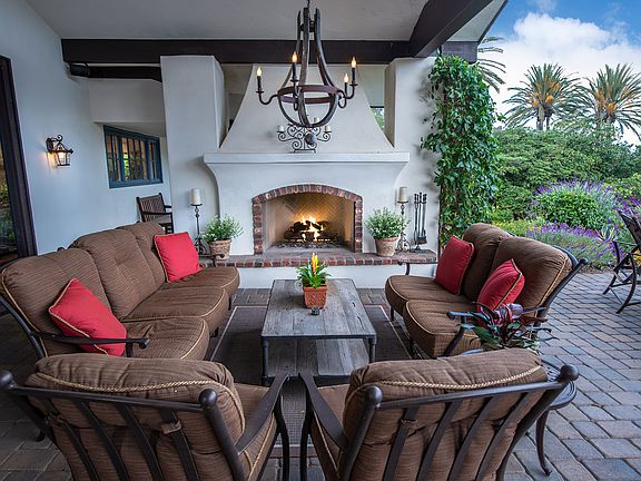 Entertain friends in the outdoor patio with wood fireplace