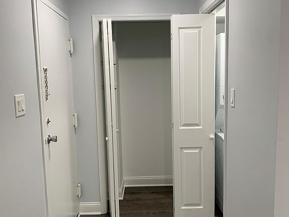 Front door, closet and laundry room.