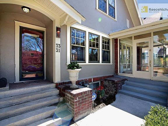 Check out the wonderful enclosed sun porch.