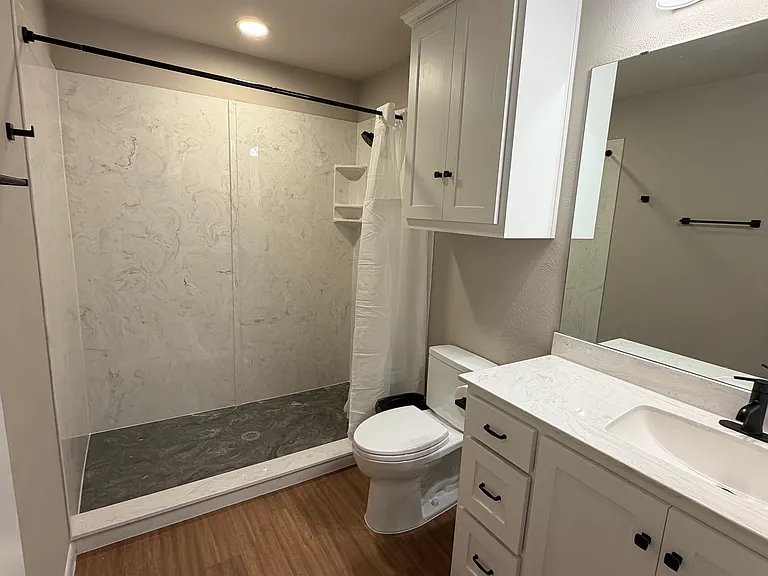 Terlingua shower is massive! 6' long! All new cultured marble shower and countertops, new fixtures, custom cabinets, electrical and plumbing.