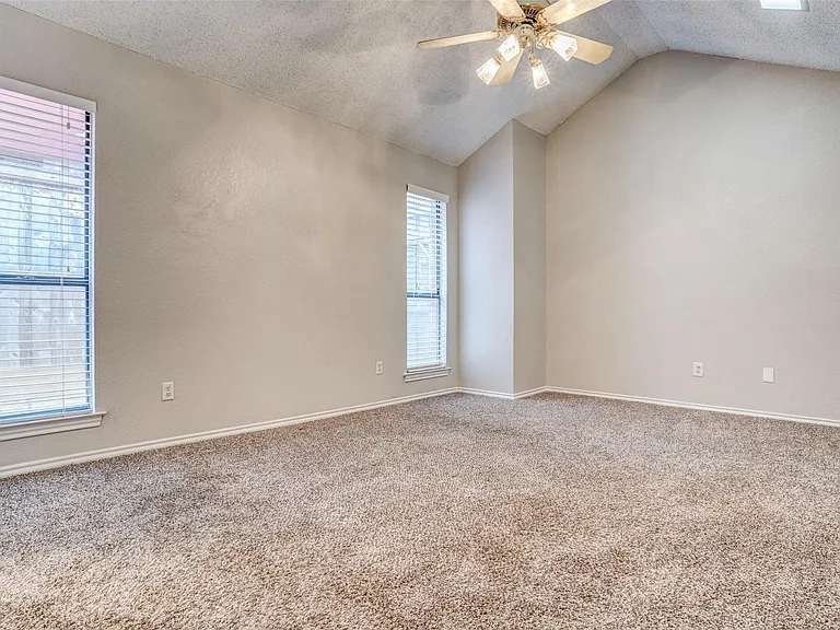 Spacious master bedroom is separate from other bedrooms.