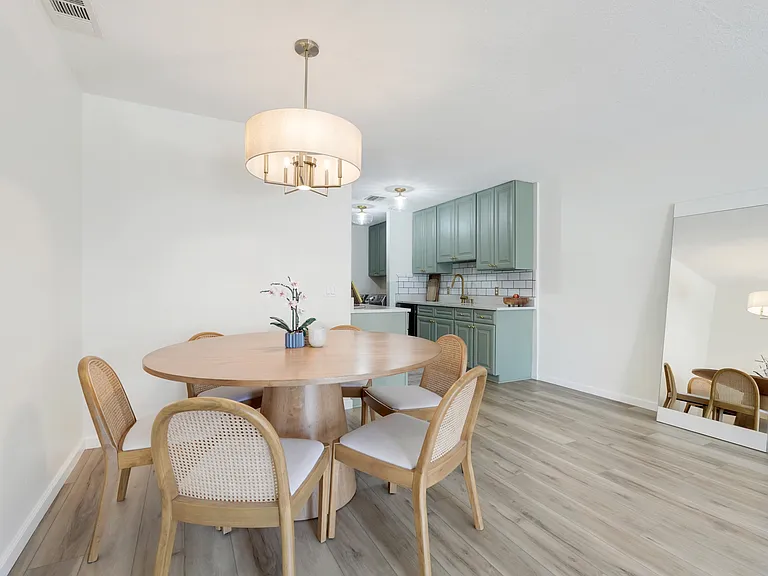 Enjoy a well-placed dining space with plenty of room for gatherings, right between the kitchen and living room.
