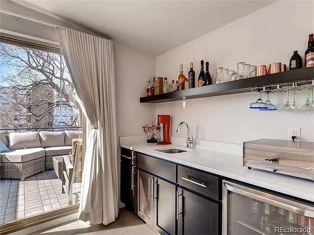 Upstairs Mini-bar with sink an 
refrigerator