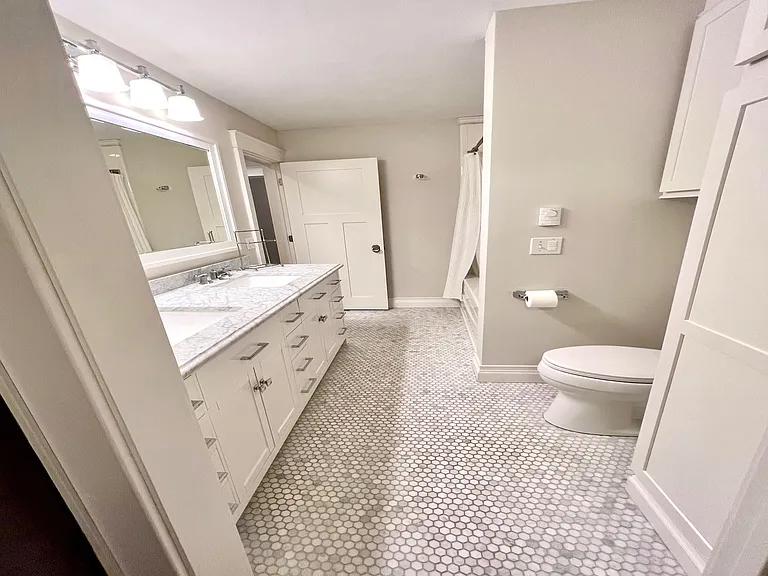 Spacious bathroom connected to walk-in closet