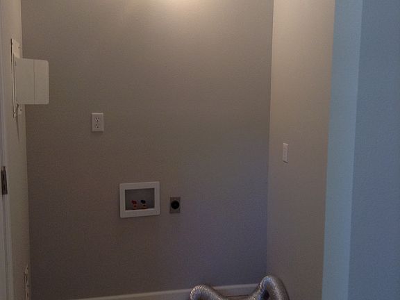 Tiled laundry room and bathr
