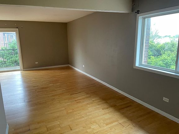 Imagine a spacious family and dining room bathed in natural light, creating a warm and inviting atmosphere for family gatherings and meals. Large windows stretch across one side of the room, offering views of lush greenery or cityscapes.