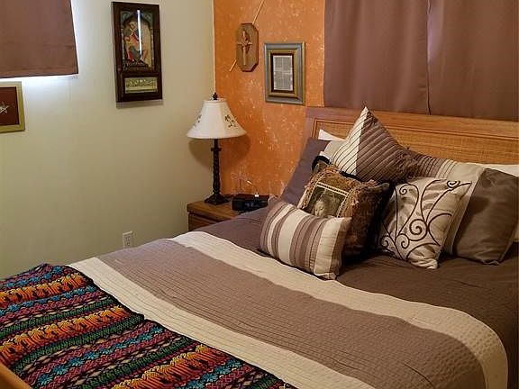 Bedroom two. Also same size, also nice big closet. Ceiling fan.