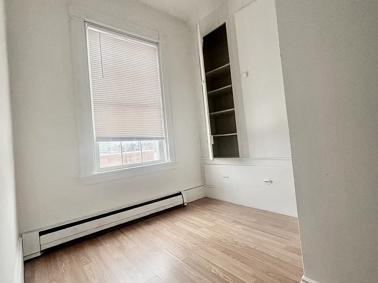 Office space with storage closet, shelving