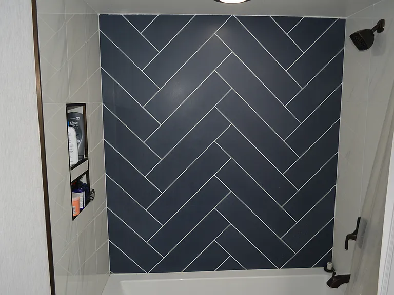 Custom-tiled bathroom with built-in wall storage