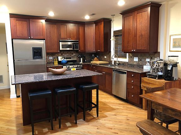 Lots of kitchen storage space, granite, disposal, extra-wide fridge