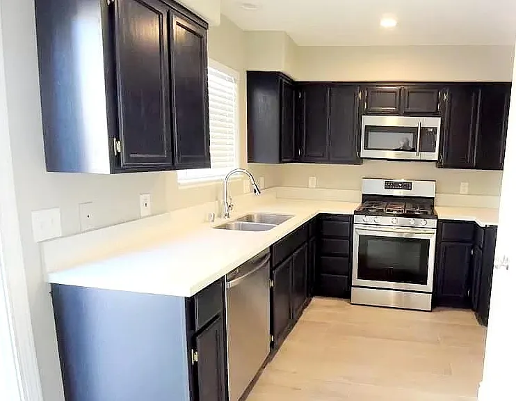 Beautiful modern kitchen with plenty of storage in cabinets and pantry