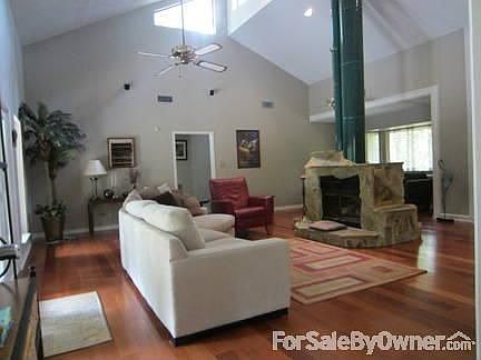 Living area
						:
						Plenty of natural light. 
Custom double sided stone gas fireplace.