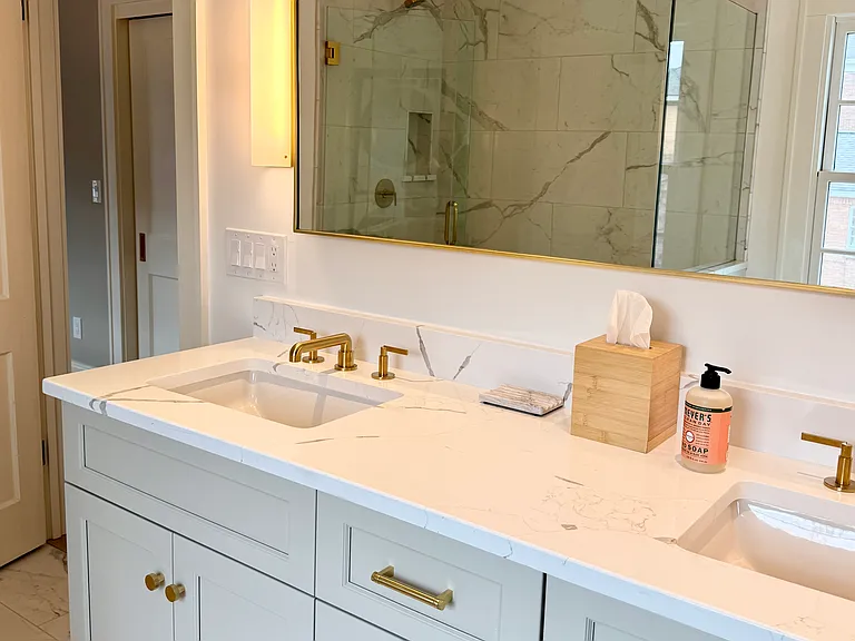 Master bathroom with walk-in shower and front-load washer/dryer