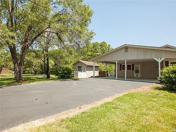 Oversized 2 car carport and hobby shop with electric