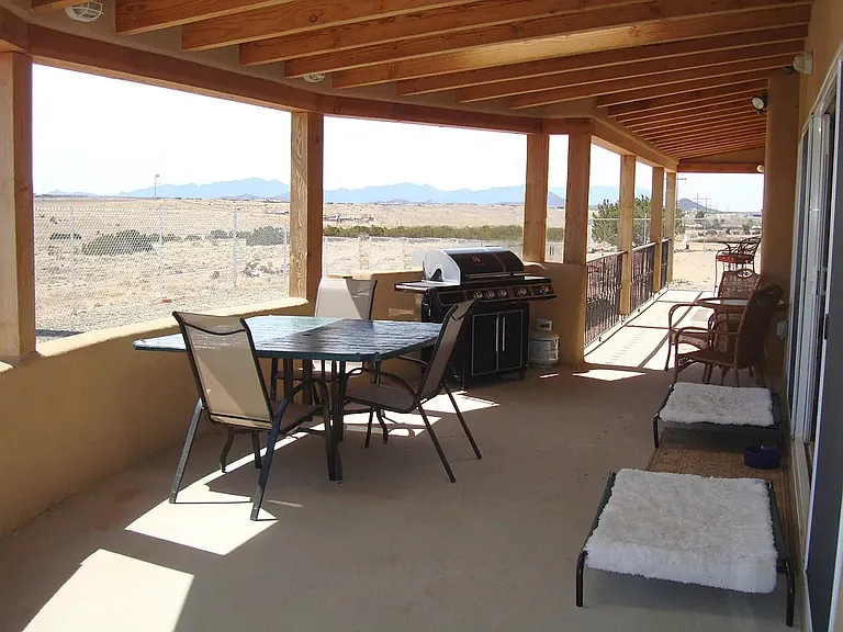 Outside to the southeast. This is an outdated pic that will be replaced today. The carport erected by previous owners will be taken down next spring.