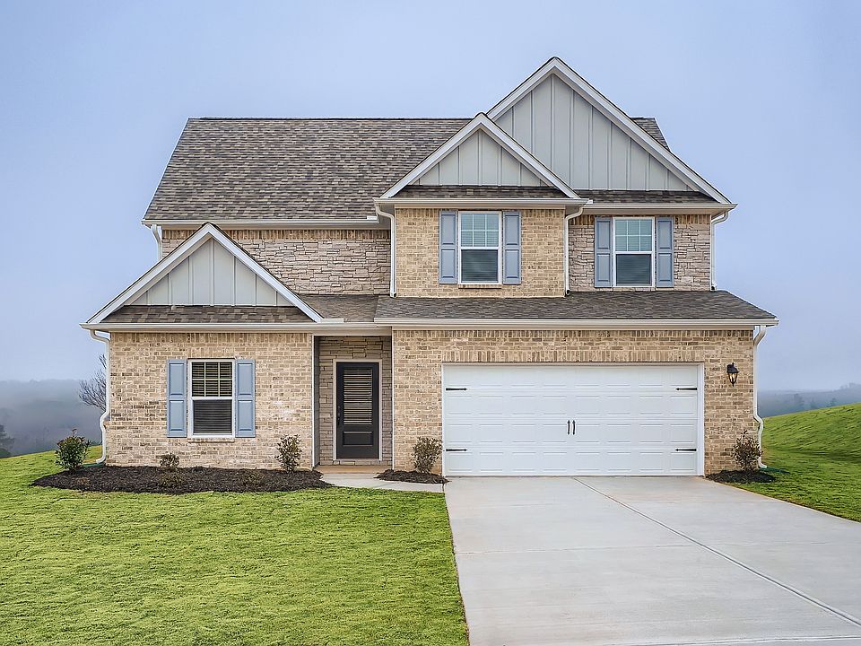 Exterior of the two-story Hartwell, showcasing a stunning selection of stone, brick and siding.