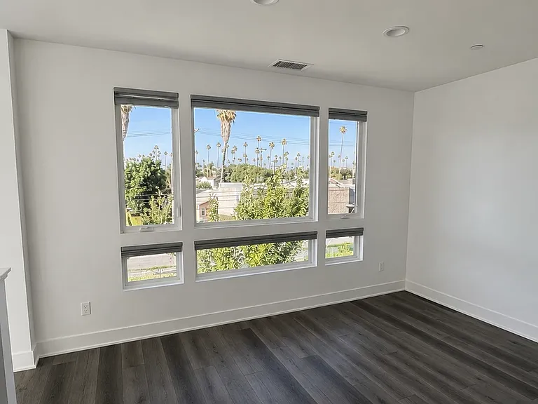 Dining room area with views of Hollywood sign, mountains, and DTLA.