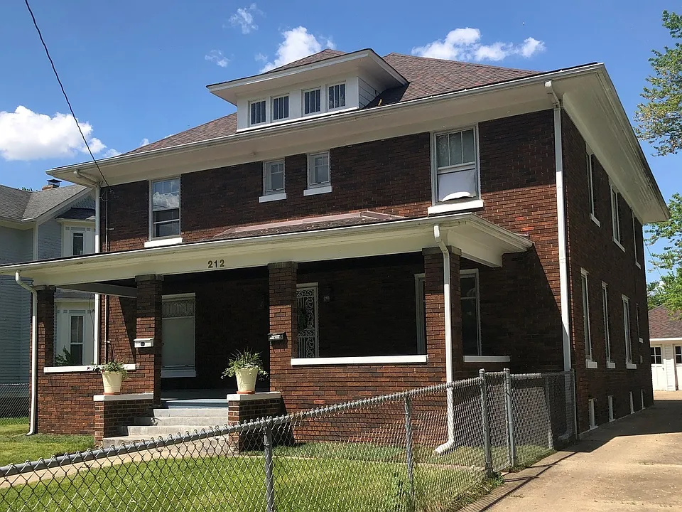 All brick building, concrete driveway & fully fenced yard