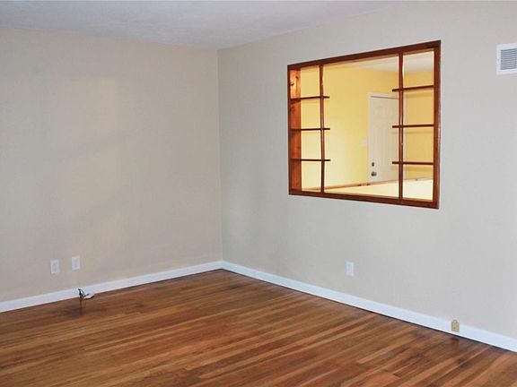 A view into the kitchen from the family room that allows the sunshine in and the breezes to flow.