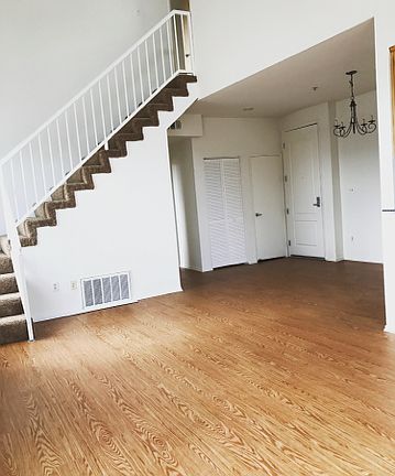 view of living room/dining and stairwell