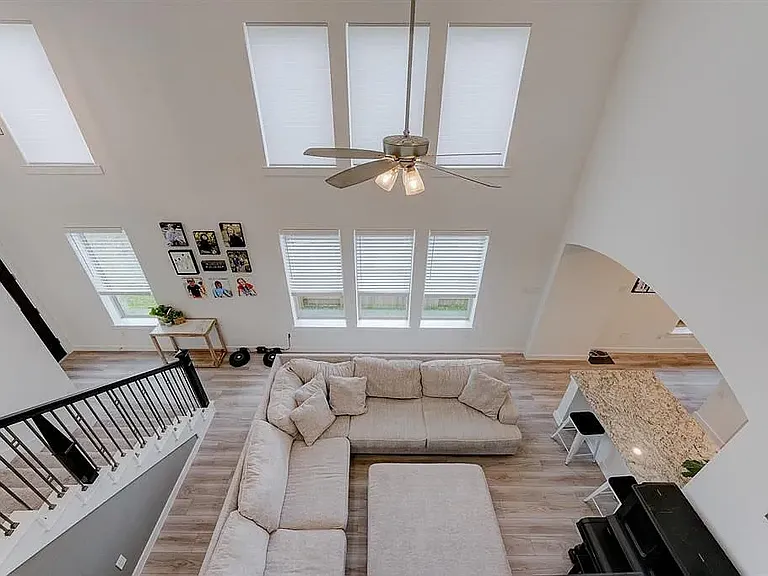 A view of the living room from the second floor balcony