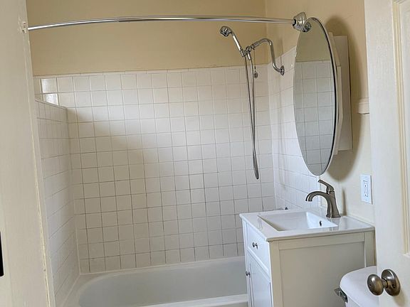 Bathroom with tiled shower and tub