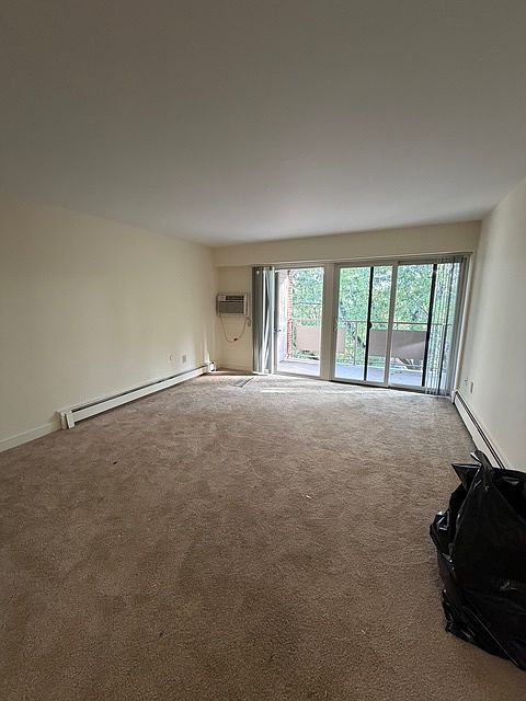 Nice sized living room with all new carpeting, opens up to private balcony.