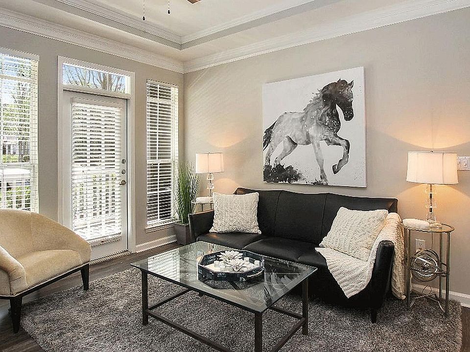 Experience elegance and comfort in this beautifully lit living room.