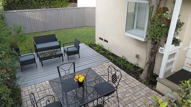 Patio, deck, fenced private yard, greenhouse window and edge of front porch.