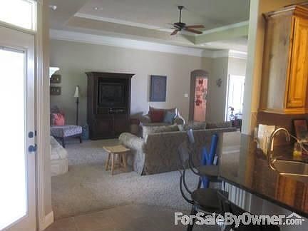 Kitchen to Large Living area
						:
						Tile in kitchen to carpet in living area.