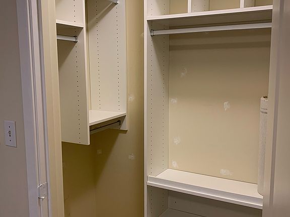 Mater Bedroom: Walk-in Closet with built-in California Closet