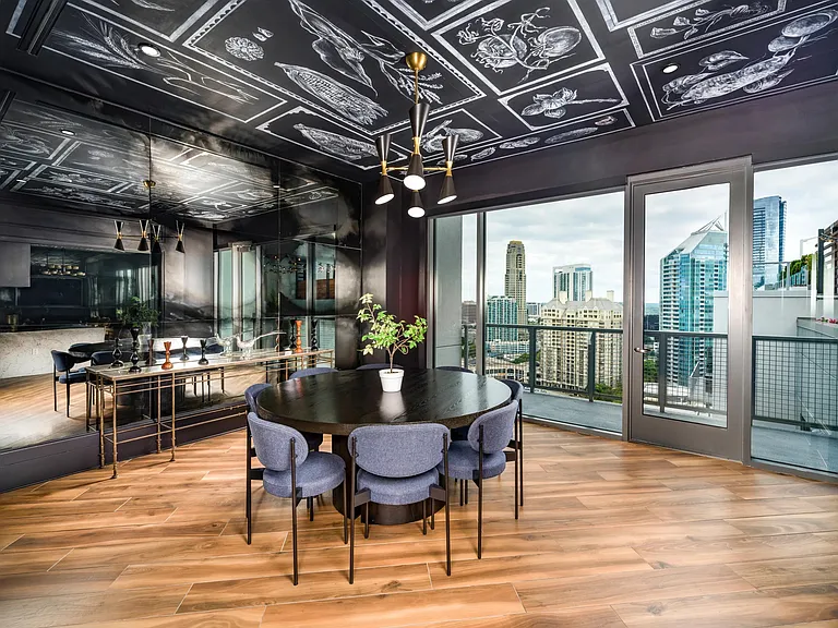 Enter the private dining lounge at Modera Old Ivy, where dramatic design, city views, and polished interiors set the tone for memorable gatherings.