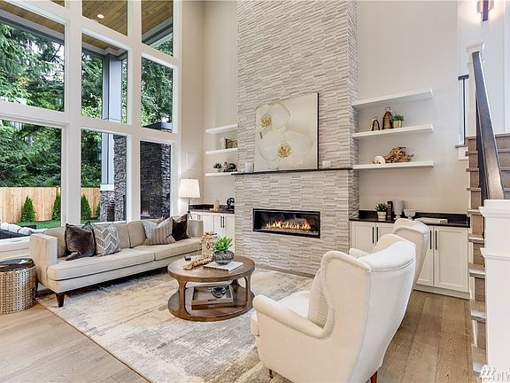 The professional kitchen is fit for a chef! Featuring Subzero refrigerator freezer, 6 burner Wolf Range Double Oven and Wolf Microwave plus beverage/wine cooler and expansive quartz surfaces.  