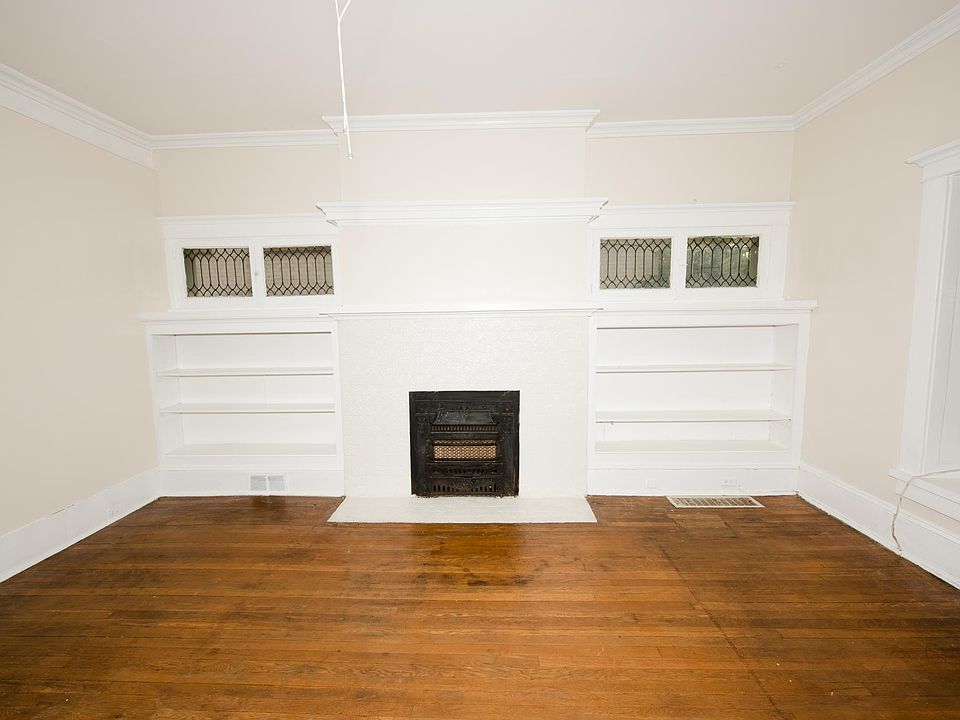 Living room Built in bookcases and leaded glass windows
