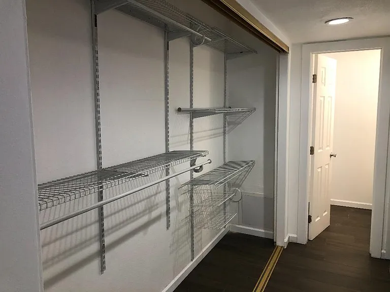 Triple doors were removed to show full closet space on left but are in place and functioning