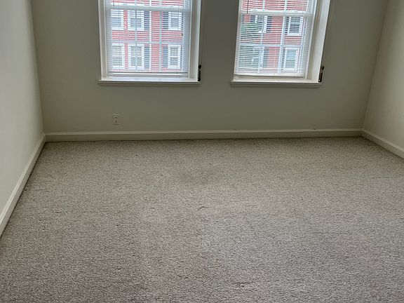 Living room with blinds on windows