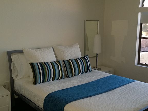 Third bedroom with Queen bed and large, empty closet.