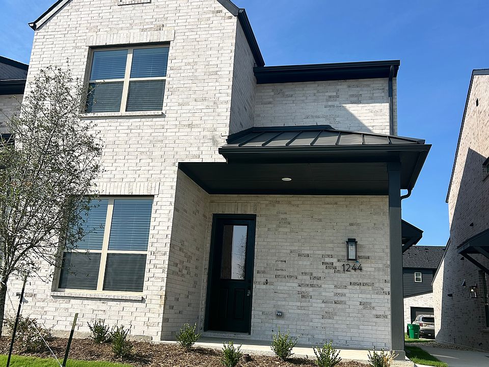 Front Exterior: Curb appeal with modern facade and landscaped front yard.