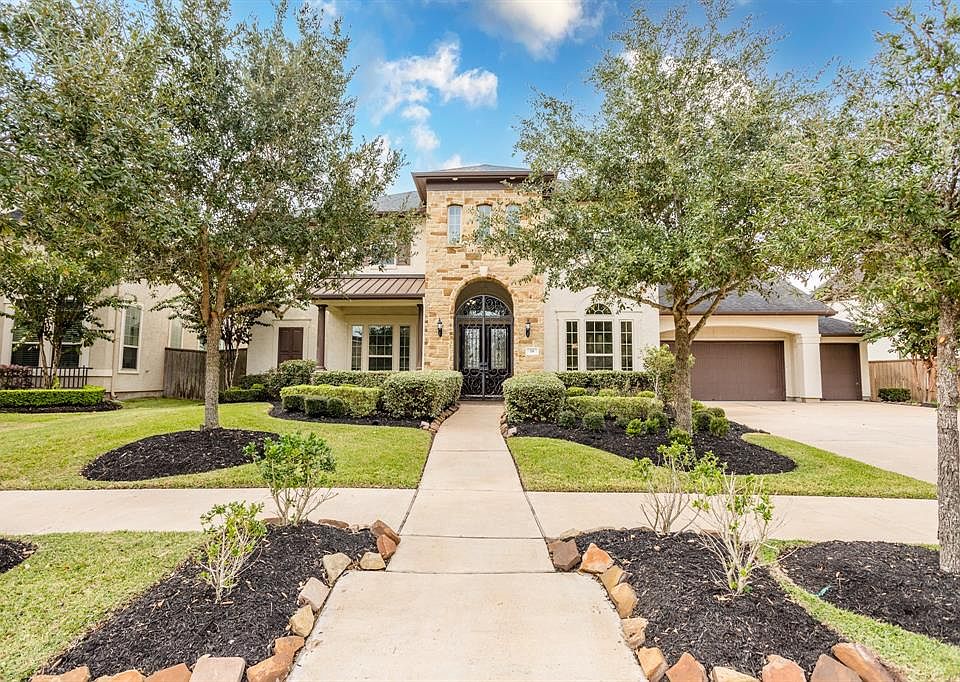 Stunning, award winning Taylor Morrison home with handsome stucco and stone elevation. This home with a gorgeous resort-like backyard is located on an oversized lot in a privately gated community.