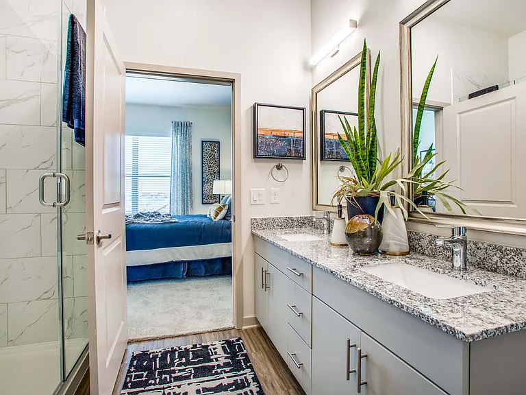 Large bathroom with double-vanity and walk-in shower
