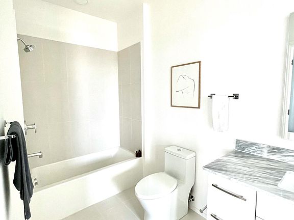 Bathroom with vertical LED lighting mirror.