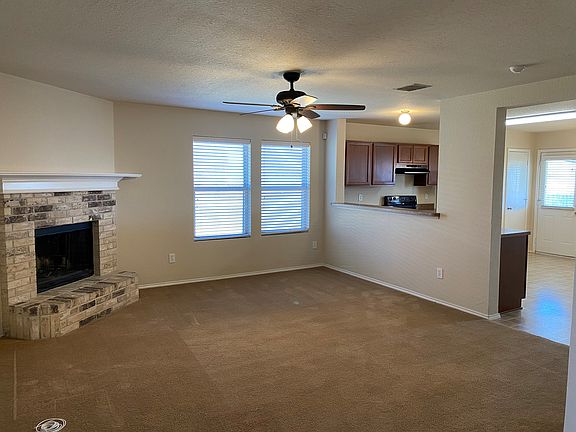 Spacious living area with pass-through to kitchen is sure to be the heart of the home.