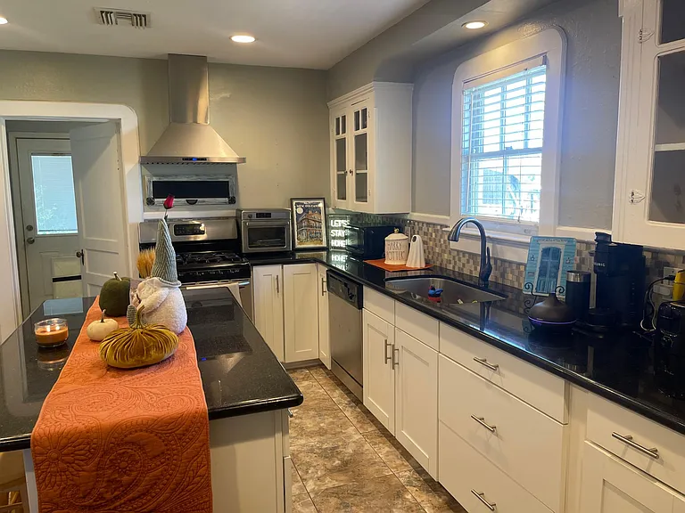 Kitchen with laundry room to the left.