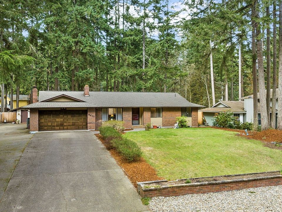 Timeless, one level living.  Left side of home is paved.>