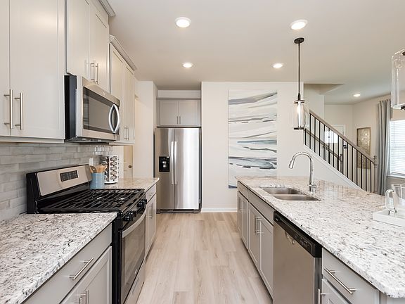 Kitchen in the Roswell floorplan at a Meritage Homes community in Atlanta, GA.