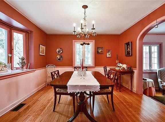 Another view of the dining room with new bow windows streaming in the natural light.