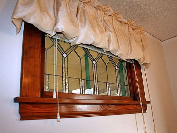 The Dining and Living Rooms also feature beautiful glass windows!