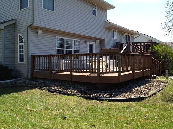 Rear from corner of yard showing 2 tier deck